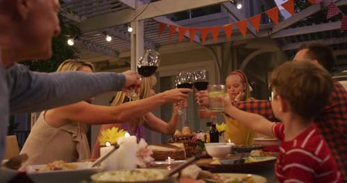 Family Celebrates Togetherness at Outdoor Dinner Party