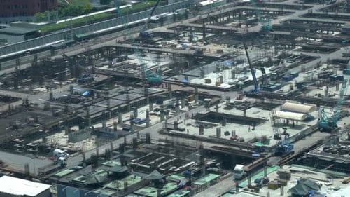 Large Construction Site with Heavy Construction Machinery in Metropolis