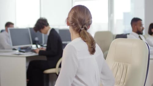 Woman Doing Stretches at Her Office Desk