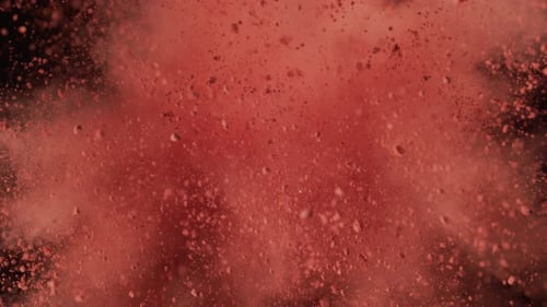 Explosion of Red Powder on a Black Background