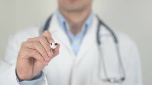 Doctor Writes Headache on Clear Surface