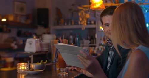 Couple with Tablet in the Bar