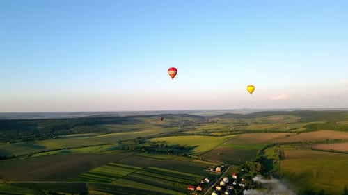 Aerial View Balloons Arriving at Sunset in a Picturesque Area