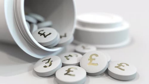 Pills with Stamped Pound Sterling GBP Symbol