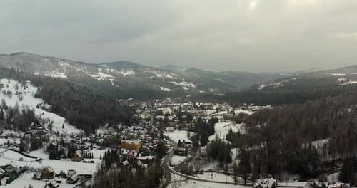 Forest Covered with Snow Aerial View. Aerial View of Village in Mountains