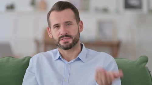 Friendly Adult Man Speaking and Waving to Camera