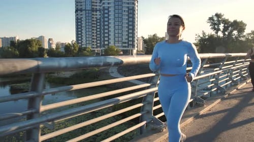 Pretty Blonde Females Going in for Sports in City