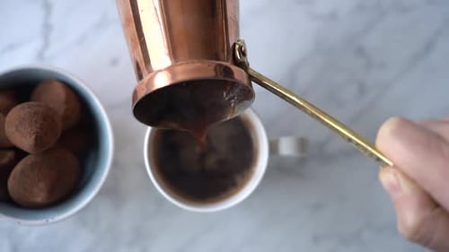 Pouring Coffee with Chocolate Truffles from Above