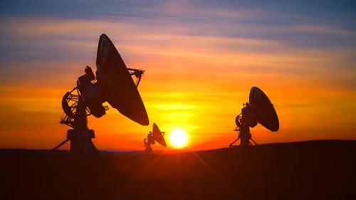 Three Radio Telescopes Against Scenic Sunset Exploring Evening Sky