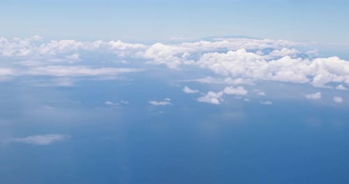 Aerial View of Ocean Meets Horizon with Clouds