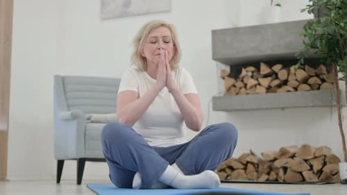 Senior Woman Practicing Yoga at Home