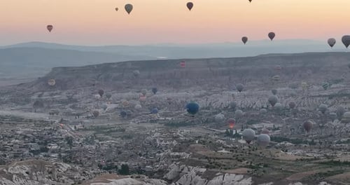 Aerial Cinematic Drone View of Colorful Hot Air Balloon Flying Over Cappadocia