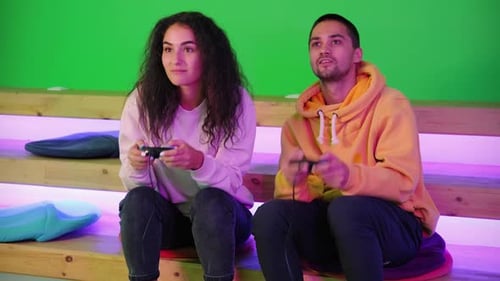 Young Adults Playing Video Games on Green Screen