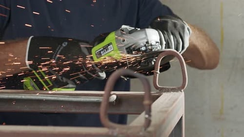 Slow motion of a metal grinder during work with sparks flying