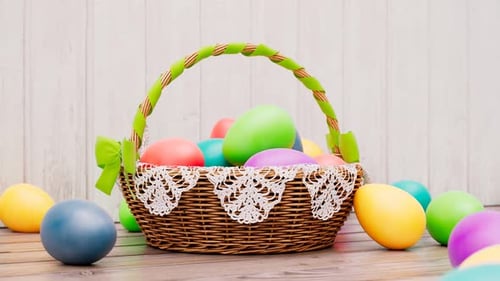 Traditional Easter basket full of cloured eggs while spring celebration.