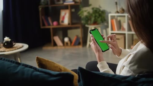 Woman Using Smartphone with Green Screen