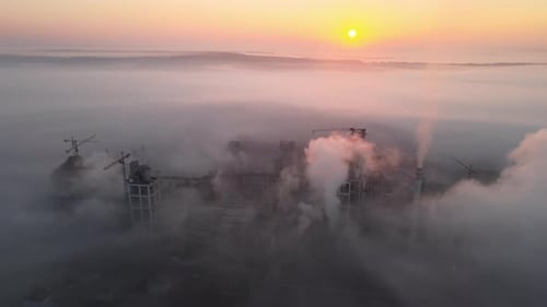 Aerial View of Cement Factory with High Concrete Plant Structure and Tower Crane at Industrial