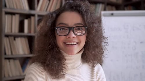 Smiling Latin Lady Teacher Wear Glasses Looking at Camera Close Up Portrait