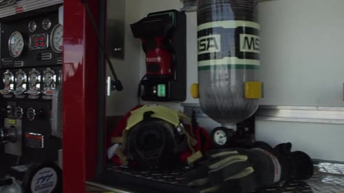 Panning view from Oxygen tanks to Firemen