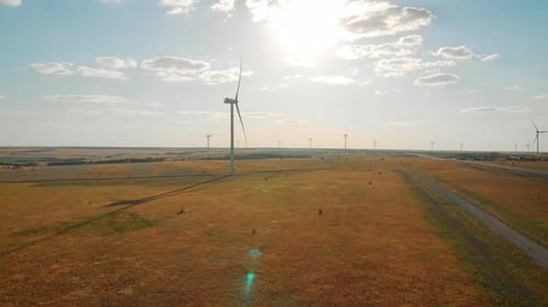 Aerial View of Wind Turbine on a Field in a Summer Day. Environment Friendly and Renewable Energy