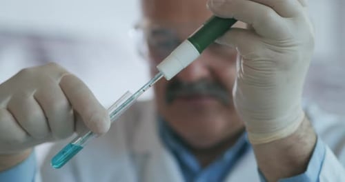 Scientist Performing an Experiment in the Lab