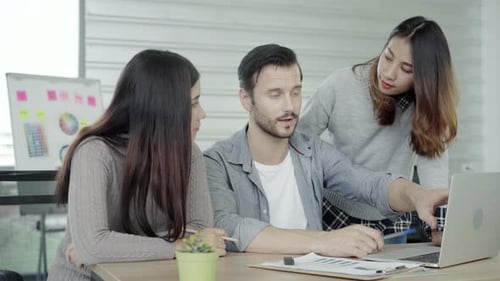 Team Discusses Project in Urban Workplace