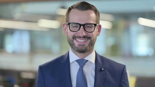 Confident Professional Smiling in Corporate Workplace