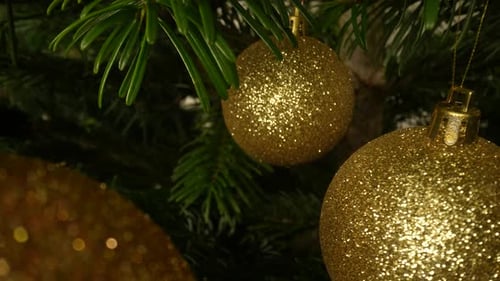 Sparkling Golden Ornaments on Christmas Tree