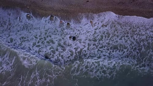 Aerial Top View Waves Break on Beach