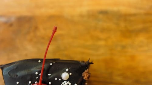 Chocolate Cake Slice with Cherry Close Up