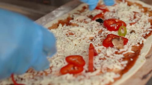 Pizza making, pizza preparation.