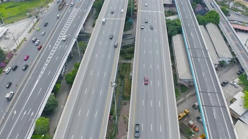 Aerial view of cars driving on highway or moterway. Overpass bridge street roads