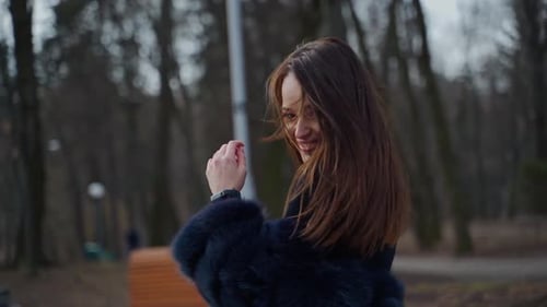 Beautiful woman outdoors. Beautiful young woman posing in park