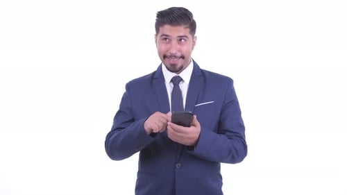 Young Businessman Uses Smartphone Against White Background