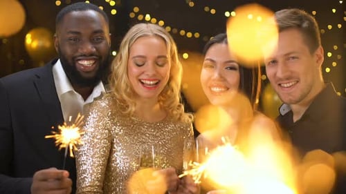 Friends Celebrate Together at Festive Party With Sparklers