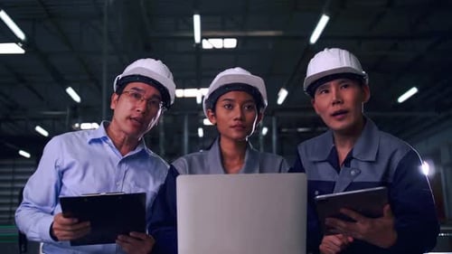 A team of engineers is explaining remote machine control to industrial owners.