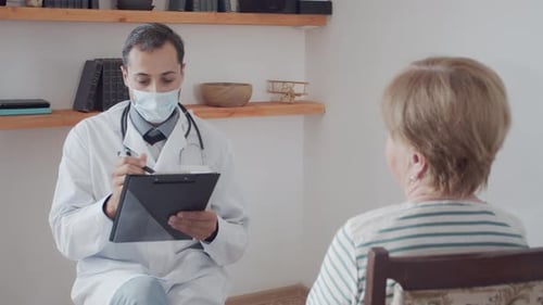 Doctor Consulting with Patient in Office