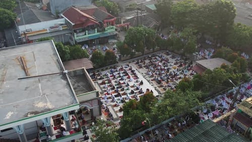 Aerial View of People offering prayers on the Eid morning at famous mosque Jama Masjid in Bekasi.