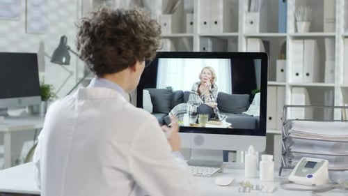 Doctor Telehealth Appointment with Female Patient on Computer