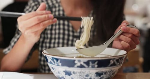 Woman Eat Noodles at Restaurant
