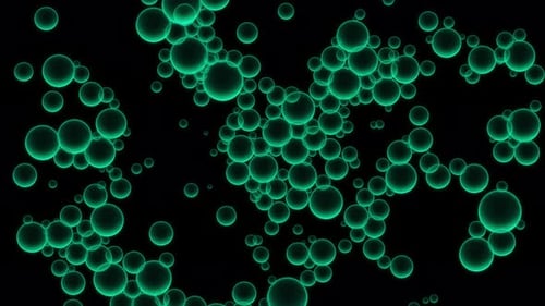 Oil green drops moving in water