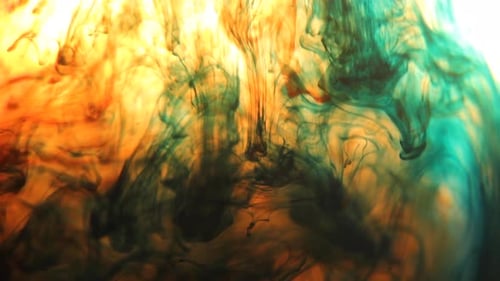 Teal, Orange and Yellow Inks Mixing Abstractly