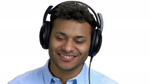 Close Up Happy Cheerful Man Listening Music in Headphones