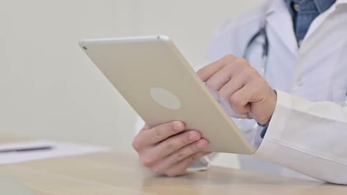 Close Up of Doctor Using Digital Tablet