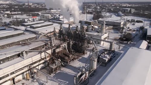Drone Backward Flies Over the Industrial Area Close to Factory Aerial Footage