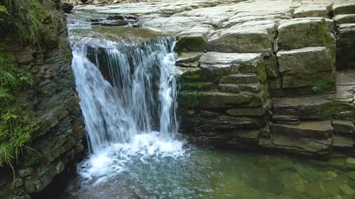 Amazing Landscape of Beautiful Waterfall on Mountain River with White Foamy Water Falling Down From