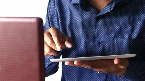 Businessman Working on Digital Tablet at Office Desk