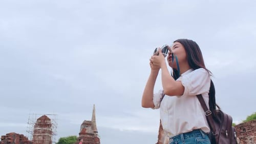 Japanese backpacker female enjoy her journey at amazing landmark in traditional city.