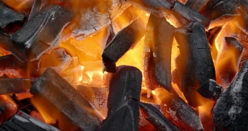 Glowing Hot Flames among Charcoals