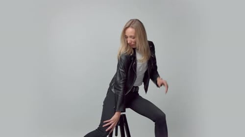 Beauty 30s Blonde Woman in Studio with Blowing Hair